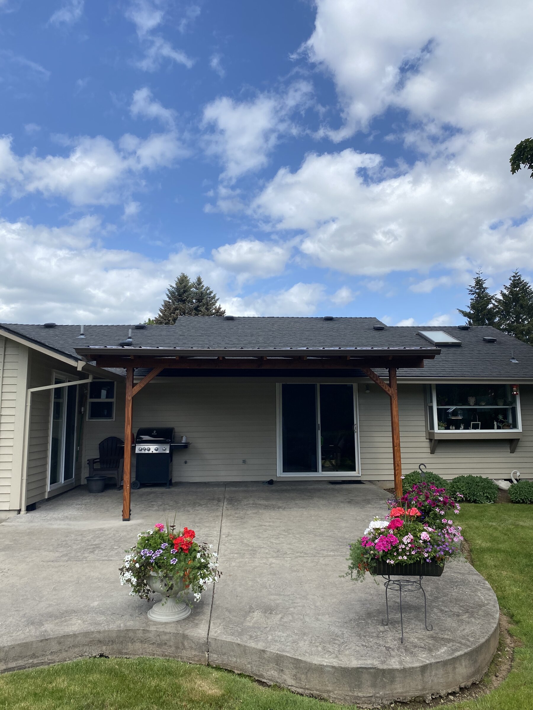 Covered patio with cedar posts and new roof